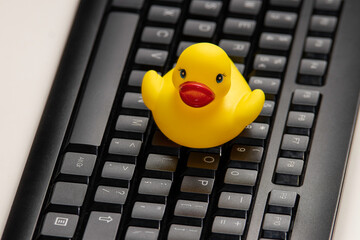 yellow duck on the black keyboard, Rubber ducky day,  rubber duck debugging