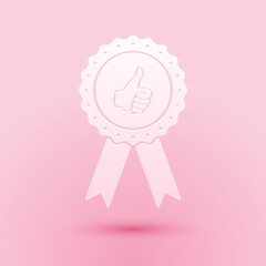 Poster - Paper cut Thumbs up on medal badge with ribbons icon isolated on pink background. Paper art style. Vector.
