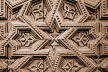 Wood Carving Ornament Pattern Background. Decorative Wooden Star Decor Craft Panel. Geometric Carved Gate Door Close-up.