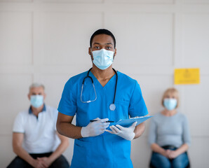 Poster - Young African American doctor in antiviral mask and uniform holding clipboard at population immunization centre