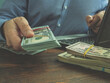 Payday cash loan online concept. Man with laptop offers money.