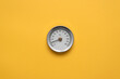 © Dmitriy - Water temperature meter on the yellow abstract background.