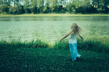 Wall Mural - child in the nature having good time