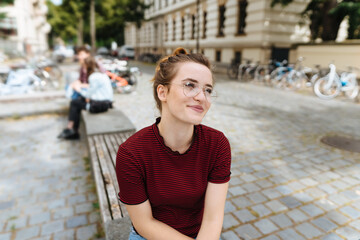 Wall Mural - Attractive young woman wearing glasses relaxing