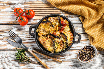 Ratatouille, homemade vegetable dish. Vegetarian food. Wooden background. Top view