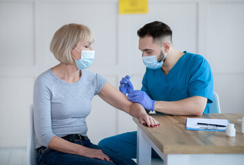 Poster - Senior lady being vaccinated against coronavirus at clinic, participating in antiviral campaign