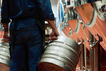 Sticker - Rear view of male worker of modern beer production plant in workwear