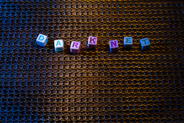 Cubes with the text DARKNET in neon light. Dark, atmospheric concept