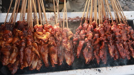 The chicken satay was burnt in large quantities