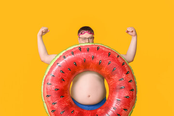 Sticker - Overweight man with inflatable ring on color background. Weight loss concept