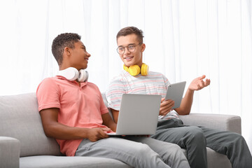 Canvas Print - Teenage boys with different devices at home