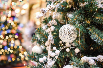 Beautiful Christmas tree with decor against blurred lights on background.