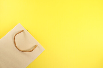 Paperbag isolated on the yellow background 