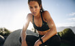 © Jacob Lund - Woman sitting outdoors after her workout