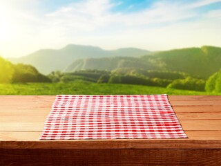 Poster - Empty wooden table with red tablecloth