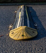 © Damian - old and heavily used yellow speed bump