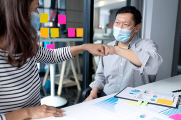 Sticker - two business people use hand to fist bump for succes teamwork