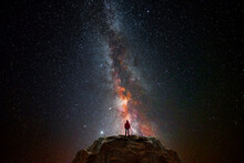 Man On Top Of A Mountain Observing The Universe