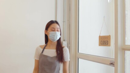 Wall Mural - Asian woman order and receive goods from delivery man coronavirus, Quarantine, contactless during a pandemic covid. Stay at home, Online shopping. Food boxes and stamp. Contactless delivery.