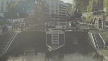A Houseboat Leaving Camden Locks In London