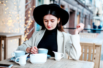 Beautiful young women drinking tea in restaurant