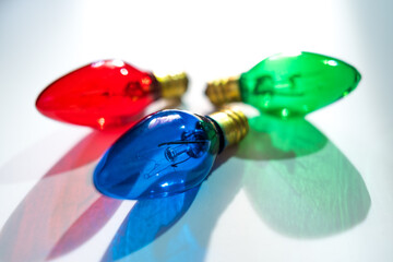 Red Green and Blue Christmas Lightbulbs on White Background