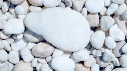 Wall Mural - white pebbles on the beach, white stone for background