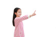 © zilvergolf - Portrait Asian little girl point index finger pressing an imaginary button isolated on white background with copy space