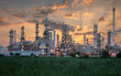 © jutawat - Industry Overview The refinery is an industrial area with sunrise and cloudy skies, oil and natural gas storage tanks, the refinery industry.