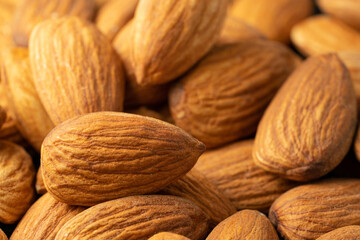 Raw almonds closeup. Macro, copy space.