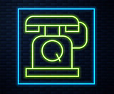 Fototapeta Sport - Glowing neon line Telephone handset icon isolated on brick wall background. Phone sign. Vector.