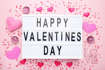 Wall Mural - Text Happy Valentines Day with hearts, candles and sprinkles on pink background