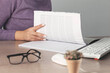 © Alla - woman hand pen with document on working desk