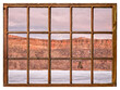 Calm dusk over Colorado foothills with frozen lake and sandstone cliff as seen from a sash window of vintage cabin