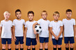 © Roman - soccer team, kids in uniform posing at camera. friendly and strong gathered before match. studio portrait
