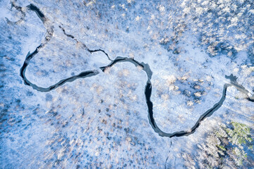 Aufkleber - River in winter forest at sunset time, aerial view