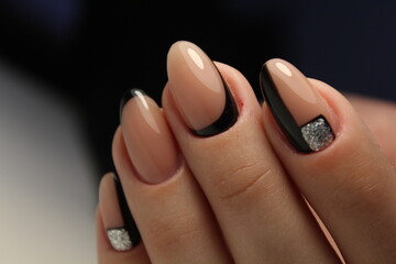 Wall Mural - beautiful manicure of nails on the background of a fashionable