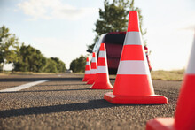 Traffic Cones Near Car Outdoors. Driving School Exam