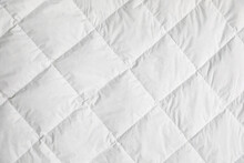 Soft Quilted Blanket As Background, Top View