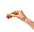 Female hand with tasty chicken nugget on white background