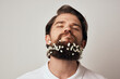 © SHOTPRIME STUDIO - Handsome man flowers in beard ornaments elegant style close-up