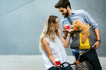 Wall Mural - Couple in love with dog walking and smiling outdoor