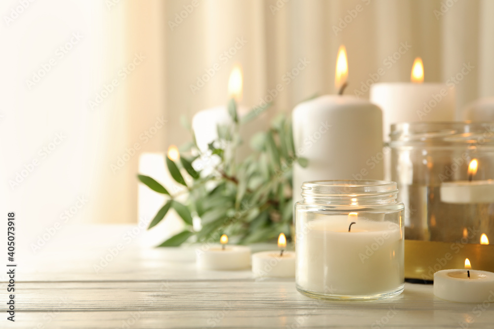 Burning scented candles for relax on white wooden table - obrazy, fototapety, plakaty 