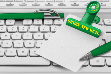 Green New Deal and paper background with PC keyboard