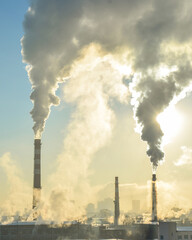 Russia . Yekaterinburg . Industrial production area on a blue sky background . The concept of environmental pollution .