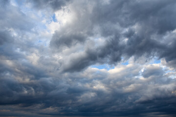 Stormy sky with storm clouns on the sunset with beautiful sun