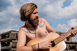 © be free - male guitarist with musical instrument. country music concept. bearded man play acoustic guitar. casual guy express emotions. hipster with long hair and moustache guitarist. For the time of your life