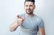© steftach - Hipster beard man pointing at you, wearing casual gray t-shirt with pointing finger. You are the one I need! Index finger. Promo people. We are waiting for you.