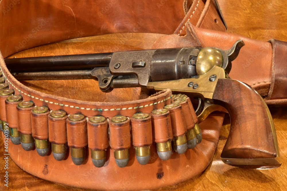 Navy colt revolver with bullets and gunbelt. Stock Photo | Adobe Stock