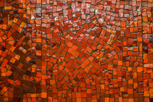 Small Ceramic Mosaic. Abstract Background, Glossy Texture Of Mosaic Tiles On The Wall. Custom-sized Red Mosaic Tiles In The Background. Space For Text.
